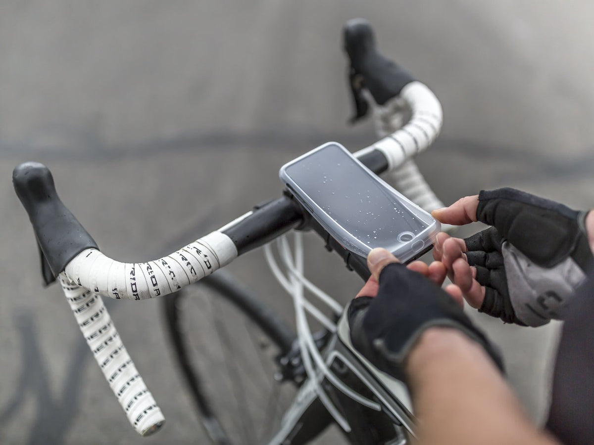 placing poncho on smartphone with quad lock case