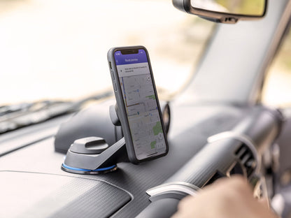 Off road car mount with wireless charging head attached to windscreen with iPhone