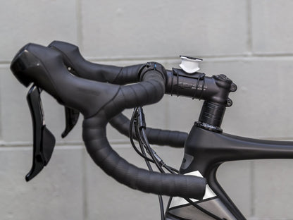 Quad Lock custom white bike mount on road bike
