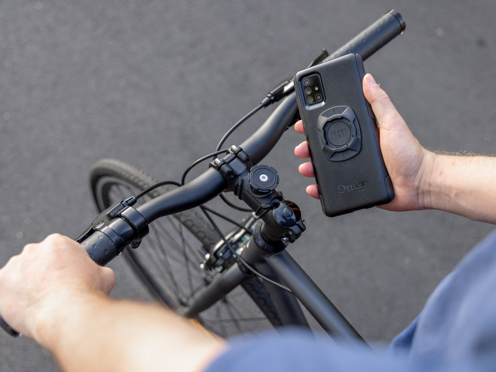 Quad Lock universal adaptor on Otterbox phone case with Stem Bike Mount