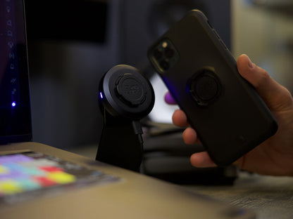 Quad Lock desk mount with iPhone and wireless charging head
