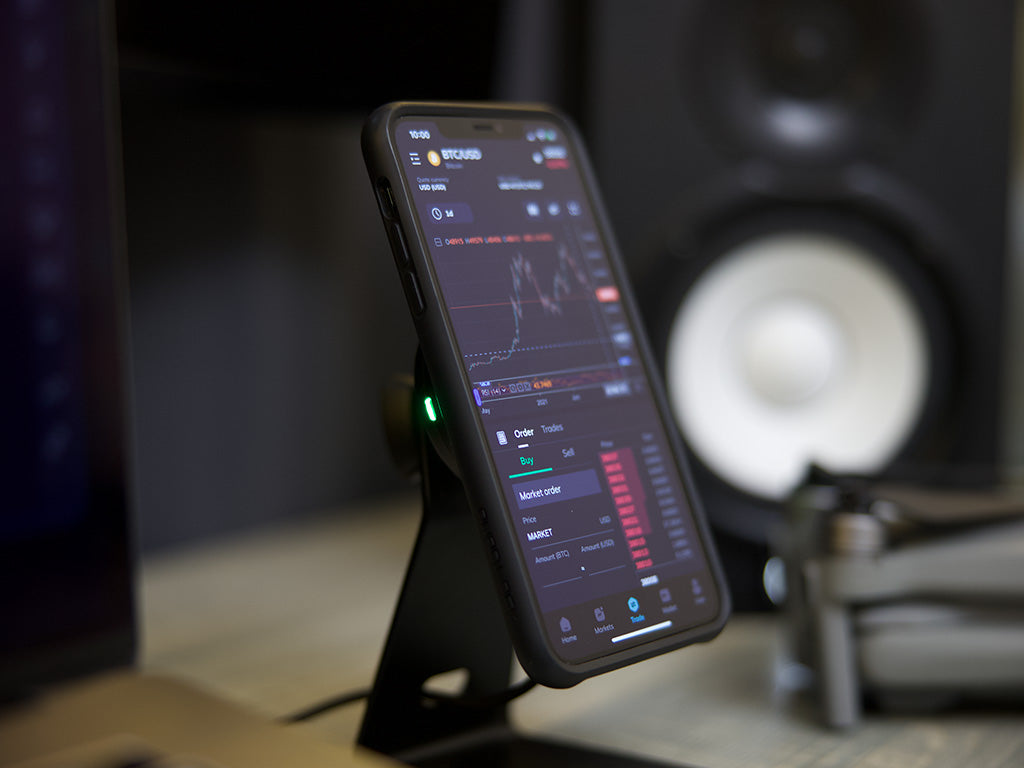 Quad Lock desk mount with iPhone and wireless charging head