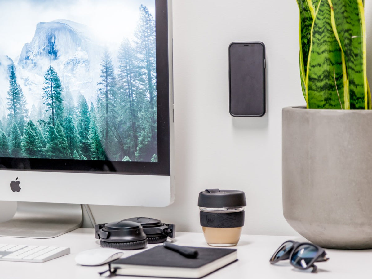 Quad Lock Adhesive Wall Mount on Office Workspace