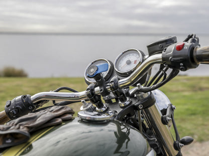 triumph with quad lock handlebar mount and moto knuckle adaptor