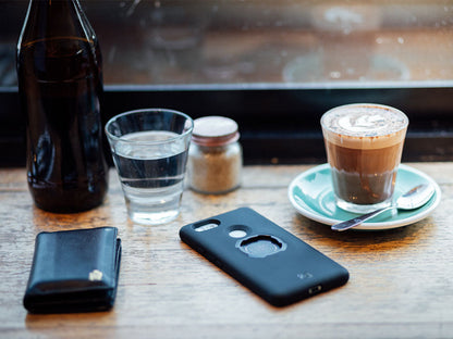 Quad Lock case for Pixel 3 on table in cafe with coffee, wallet and water