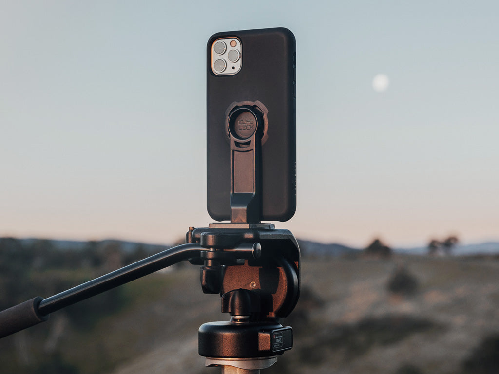 iphone 11 pro attached to tripod using quad lock adaptor